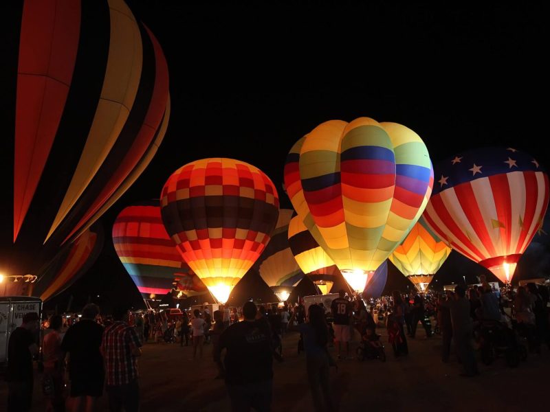 Glowing hot air balloons at nighttime festival