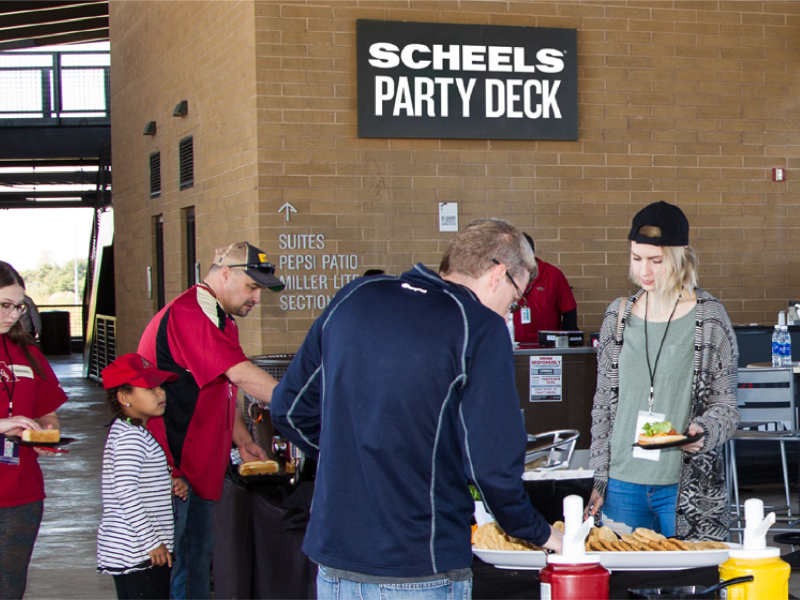 People serving themselves food at Scheels Party Deck.